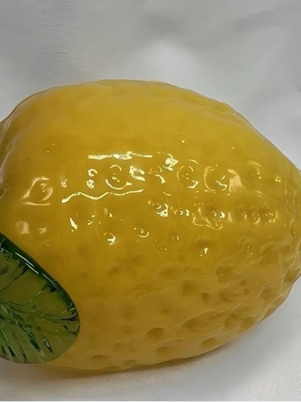 Glossy Yellow Ceramic Lemon with Green Leaf Accent